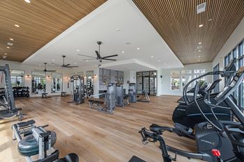 Well appointed fitness center with peloton bikes