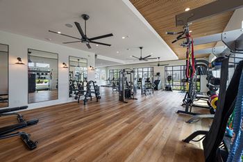 Well appointed fitness center with peloton bikes