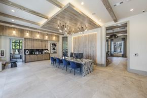 Powder Springs apartment for rent - a large dining room with a long table with blue chairs