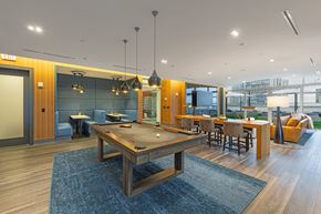 Atlanta apartment for rent - a communal area with a pool table and a dining area