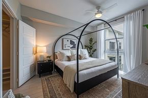 Miami apartment for rent - a bedroom with a bed and a ceiling fan