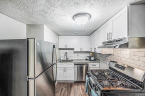 East Point apartment for rent - a kitchen with stainless steel appliances and white cabinets
