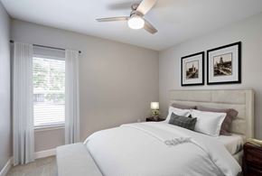 Colorado Springs apartment for rent - A bedroom with a large bed and two pictures on the wall.