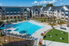 Lawrenceville apartment for rent - an aerial view of an apartment complex with a swimming pool