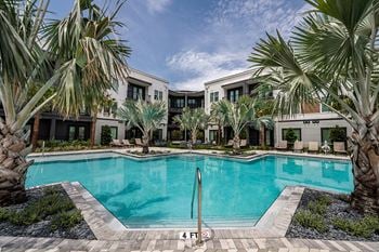 Refreshing swimming pool w/ sun shelf and lounging areas