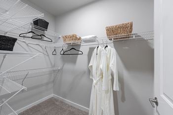 Spacious walk-in closets with custom shelving