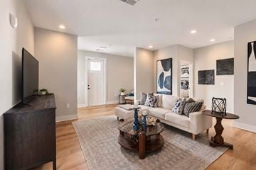 Gallatin apartment for rent - A living room with a white couch and a coffee table.