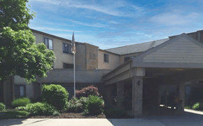 Saginaw apartment for rent - a building with an american flag in front of it