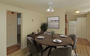 Knoxville apartment for rent - A dining room with a table set for two and a potted plant.