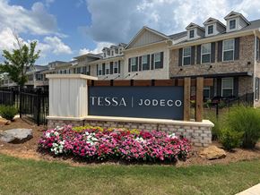 Mcdonough apartment for rent - A sign that says Tessa Jodeco in front of a building.
