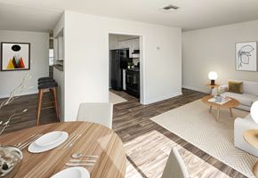 Knoxville townhouse for rent - A modern dining room with a wooden table set for two.
