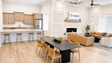 Knoxville apartment for rent - A modern kitchen with wooden cabinets and a black island.