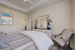 Huntersville apartment for rent - A bedroom with a large bed and a chair.