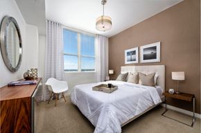 Fort Lauderdale apartment for rent - a bedroom with a bed and a desk with a chair