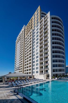 Fort Lauderdale apartment for rent - a large building with a pool in front of it