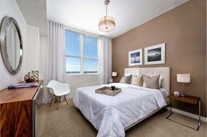 Fort Lauderdale apartment for rent - a bedroom with a bed and a desk with a chair at Regatta at New River, Fort Lauderdale, 33301