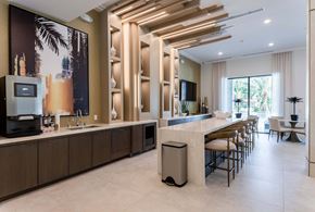 Wellington apartment for rent - A modern kitchen with a long counter and a large painting on the wall.