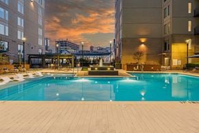 Atlanta apartment for rent - Luxury Apartments For Rent In Atlanta, GA - Venue Brookwood - Saltwater Pool With Spacious Sundeck, Submerged And Poolside Lounge Chairs, And Fountain.