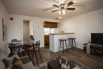 Knoxville apartment for rent - A living room with a grey couch and a brown coffee table.