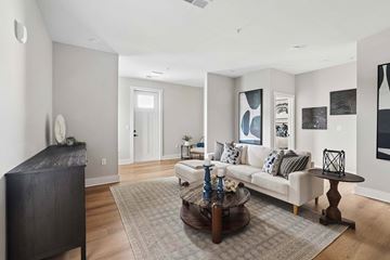 Gallatin apartment for rent - A living room with a white couch and a coffee table.