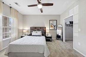 Cleveland apartment for rent - A bedroom with a large bed and a ceiling fan.
