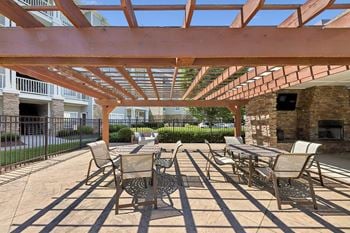 Outdoor lounge with tv and fireplace