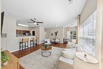 Cleveland apartment for rent - A living room with a white couch and a ceiling fan.