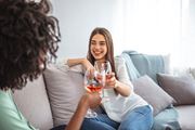 Plantation apartment for rent - two women sitting on a couch drinking wine