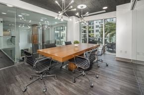Tampa apartment for rent - A conference room with a long table surrounded by chairs.