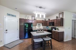 Easley apartment for rent - A kitchen with a table and chairs in the middle of it.