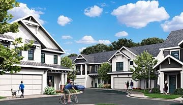 Mauldin townhouse for rent - A row of houses with people walking and riding bikes in front.