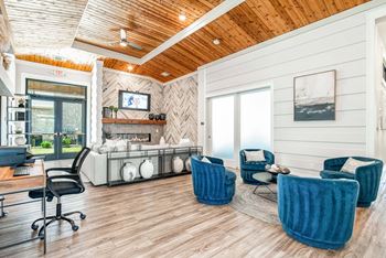 Two clubhouses featuring indoor lounge, fireplace, kitchen and gaming area with shuffleboard