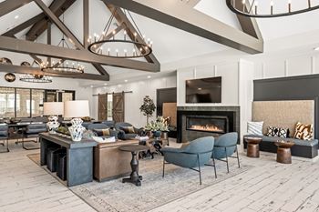 Clubroom with seating areas, computer workspaces, and coffee bar with refreshments