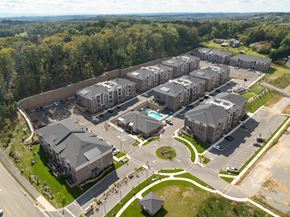 Farragut apartment for rent - Aerial view of apartment complex with green spaces, walking paths, and pools in West Knoxville, TN.