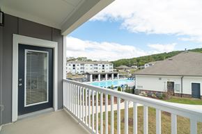 Cleveland apartment for rent - A balcony with a view of a pool and houses.