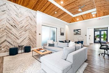 Two clubhouses featuring indoor lounge, fireplace, kitchen and gaming area with shuffleboard