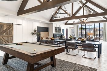 Clubroom with seating areas, computer workspaces, and coffee bar with refreshments