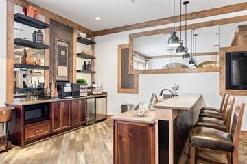 Johnson City apartment for rent - A kitchen with wooden cabinets and a large mirror on the wall.