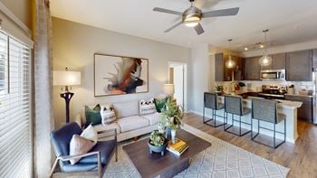 Stainless steel kitchen appliances including top freezer with ice maker, electric radiant smooth cooktop range, dishwasher with advanced dry cycle, microwave, and disposal.