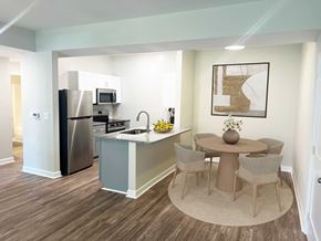 Charlotte apartment for rent - a kitchen and dining area with a stainless steel refrigerator