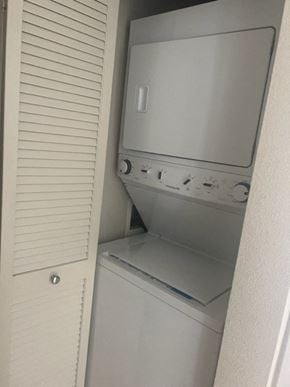 Honolulu condo for rent - a washer and dryer are in a closet