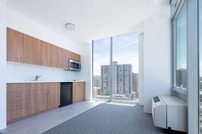 Honolulu condo for rent - a kitchen with a large window and a city view