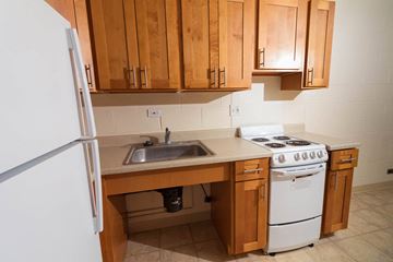Haleiwa apartment for rent - a kitchen with a sink and a refrigerator