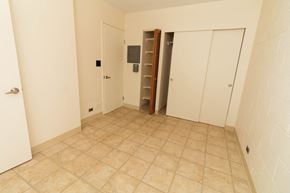 Haleiwa apartment for rent - a room with a tiled floor and two closets