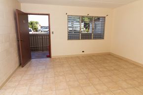Haleiwa apartment for rent - an empty room with a window and a door to a balcony