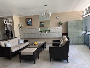 Honolulu apartment for rent - A living room with a sofa, chair, and coffee table.