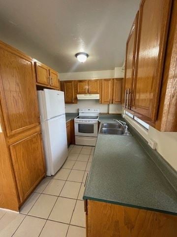 Honolulu apartment for rent - A kitchen with wooden cabinets and white appliances.