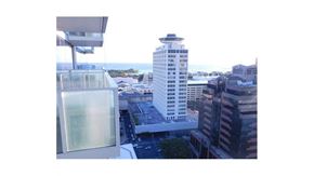 Honolulu condo for rent - a tall building with a observation deck on top of it