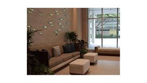 Honolulu condo for rent - a living room filled with furniture and a large window