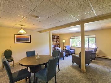 South Burlington apartment for rent - a living room with a table and chairs and a library